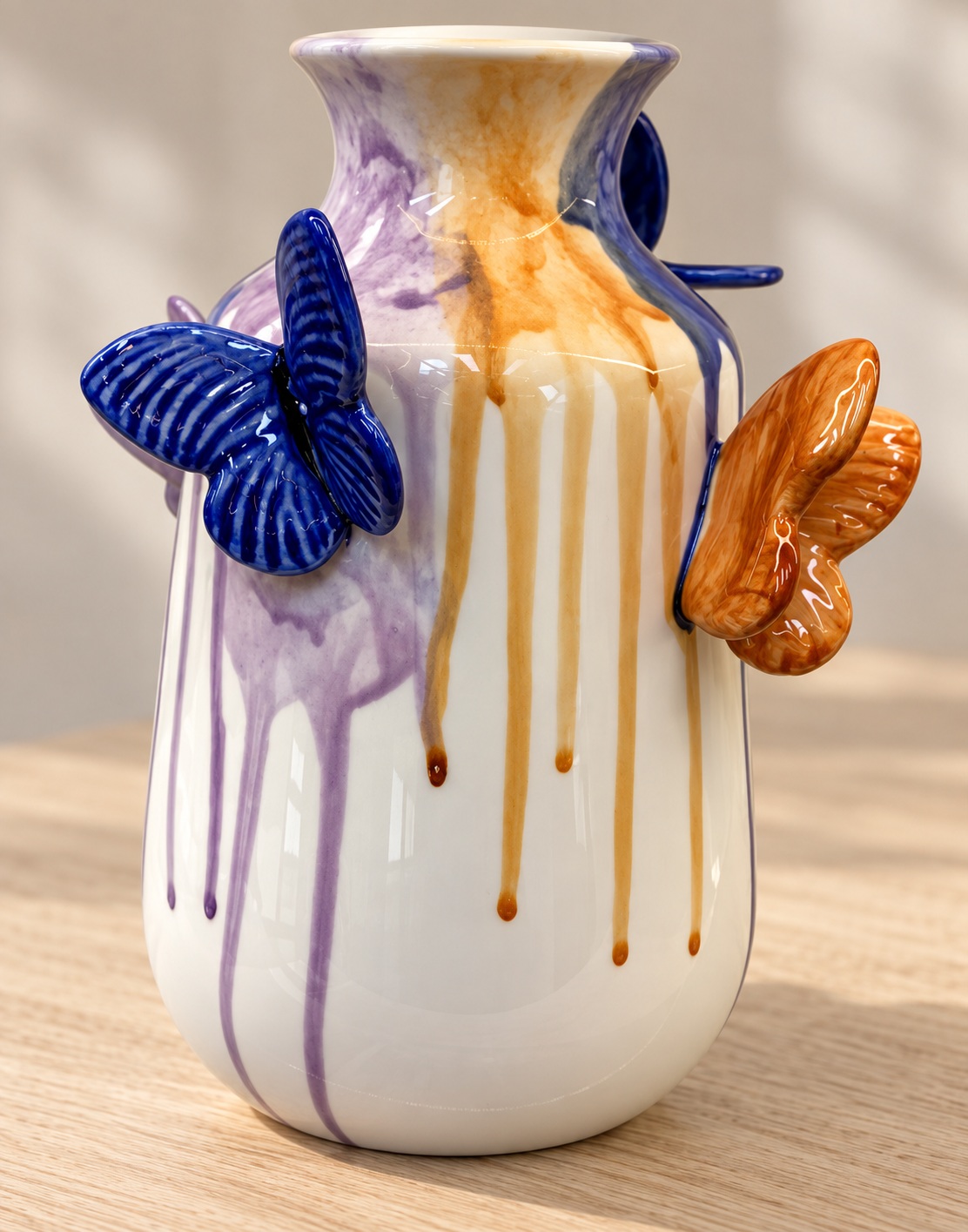 White Ceramic Vase with Raised Butterfly Accents and Purple-Gold Drip Glaze 2